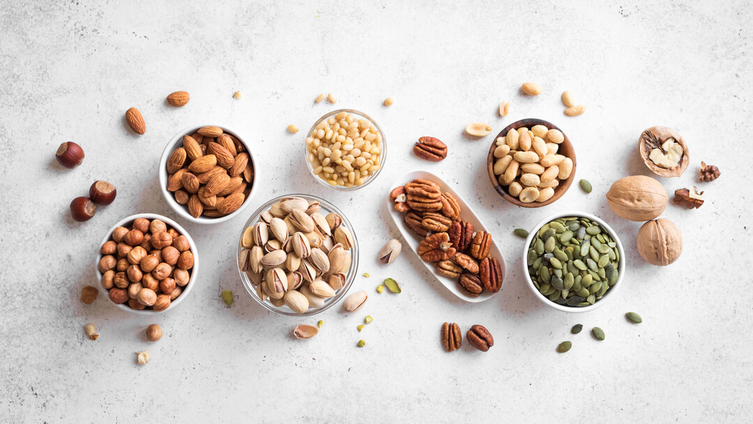 Different types of nuts in bowls