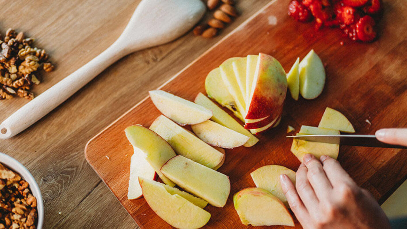 Sliced apples on wood