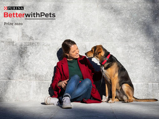 Better with pets prize woman sat with dog